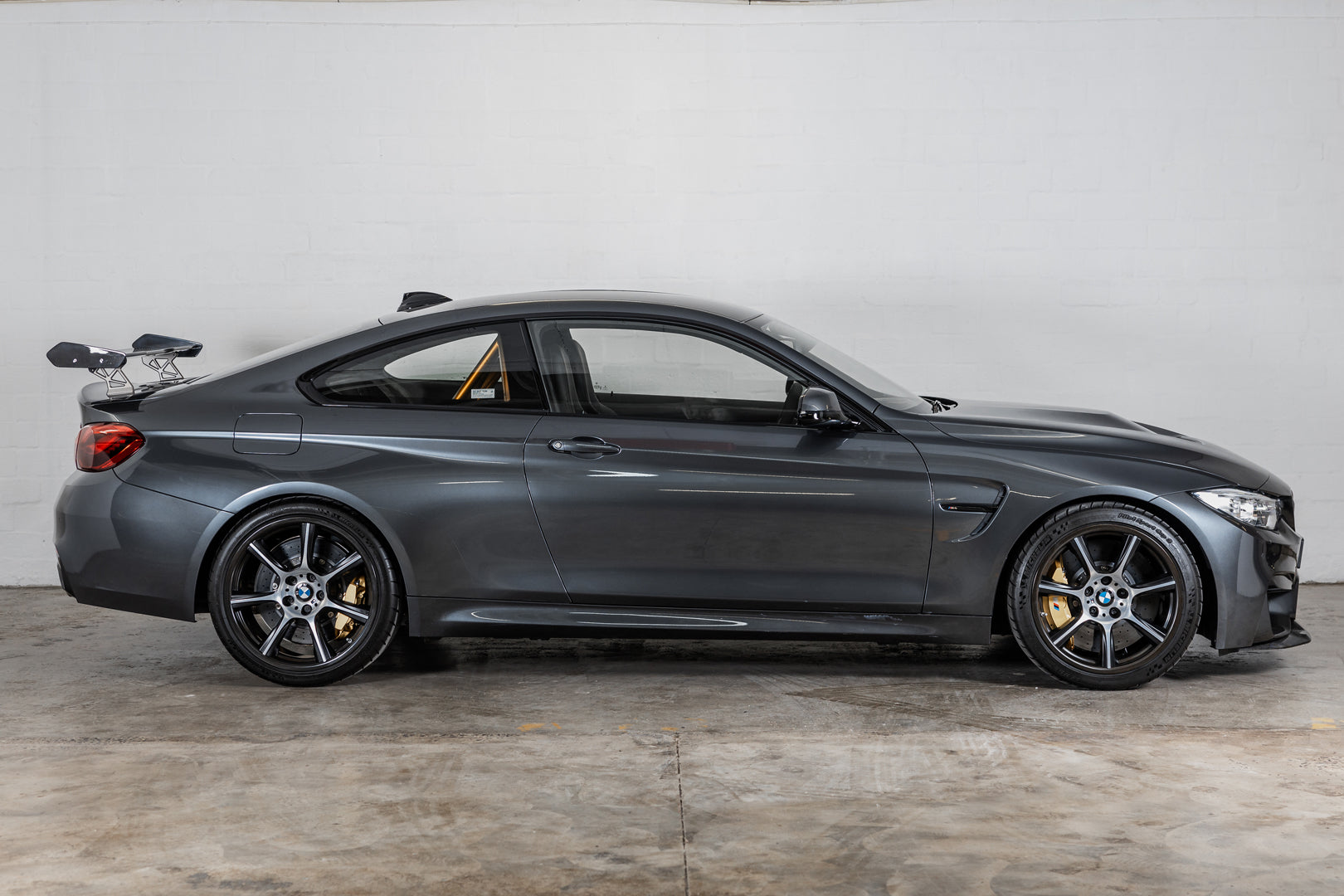 Side profile of a BMW M4 GTS showing the wing