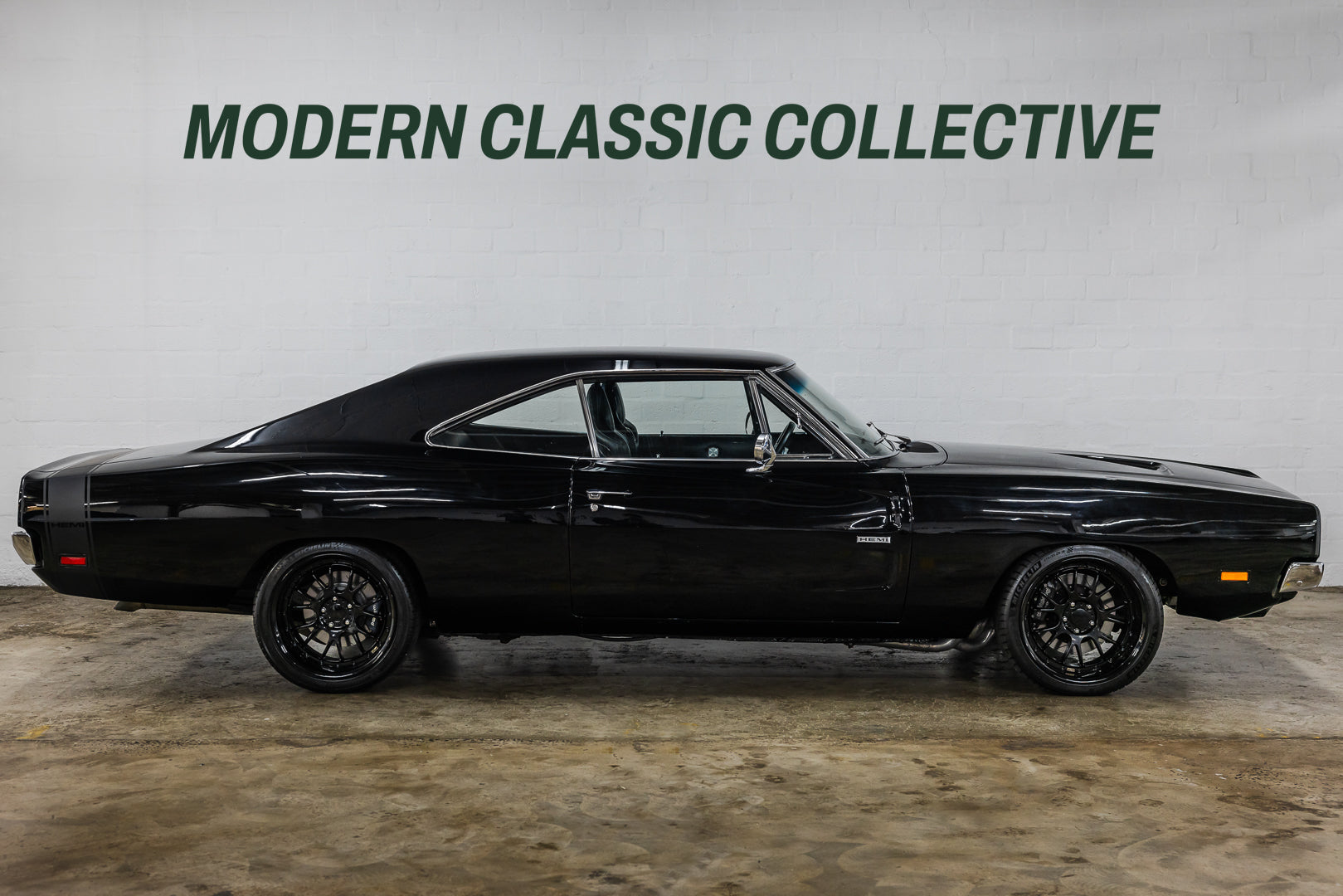 Black classic 1969 Dodge Charger RT on a gray background with 'Modern Classic Collective' text.